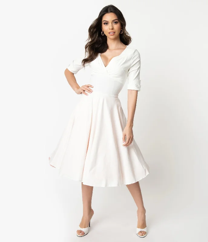 Pleated Women Dress with a Timeless and Elegant TextureUnique Vintage Ivory Delores Swing Dress with Sleeves